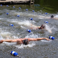 Coach swimming to kids at summer camp.jpg?ixlib=rails 2.1