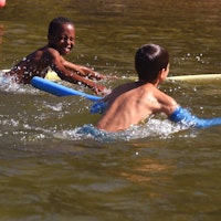 Boys playing in lake at massachusetts summer camp.jpg?ixlib=rails 2.1