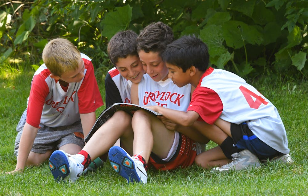 Boys camp kids reading magazine.jpg?ixlib=rails 2.1