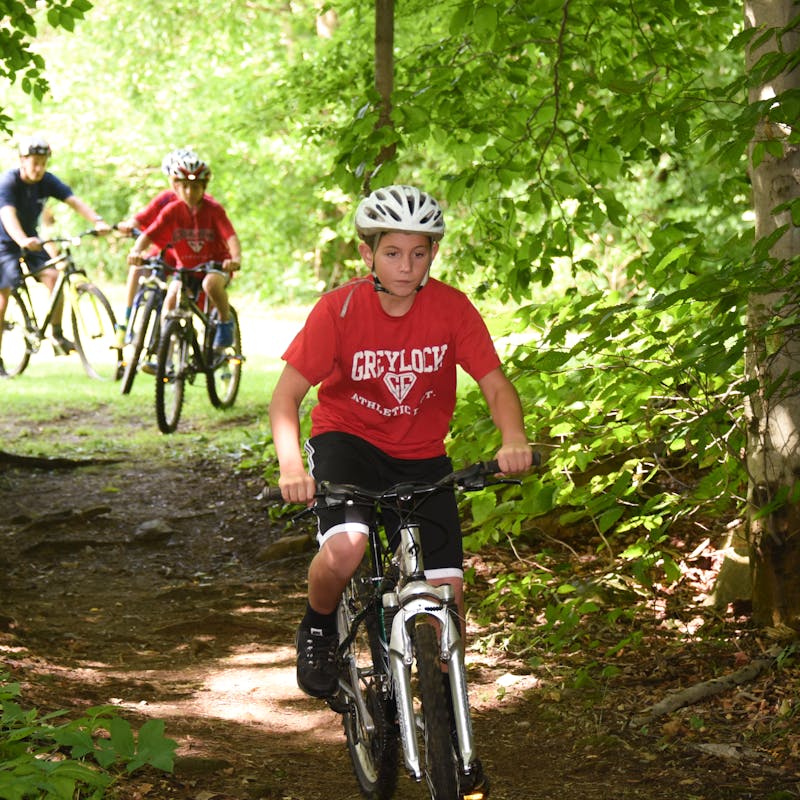 Mountain biking in woods boys summer camp adventure.jpg?ixlib=rails 2.1