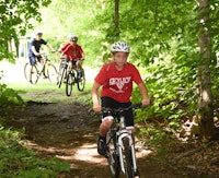 Mountain biking in woods boys summer camp adventure.jpg?ixlib=rails 2.1