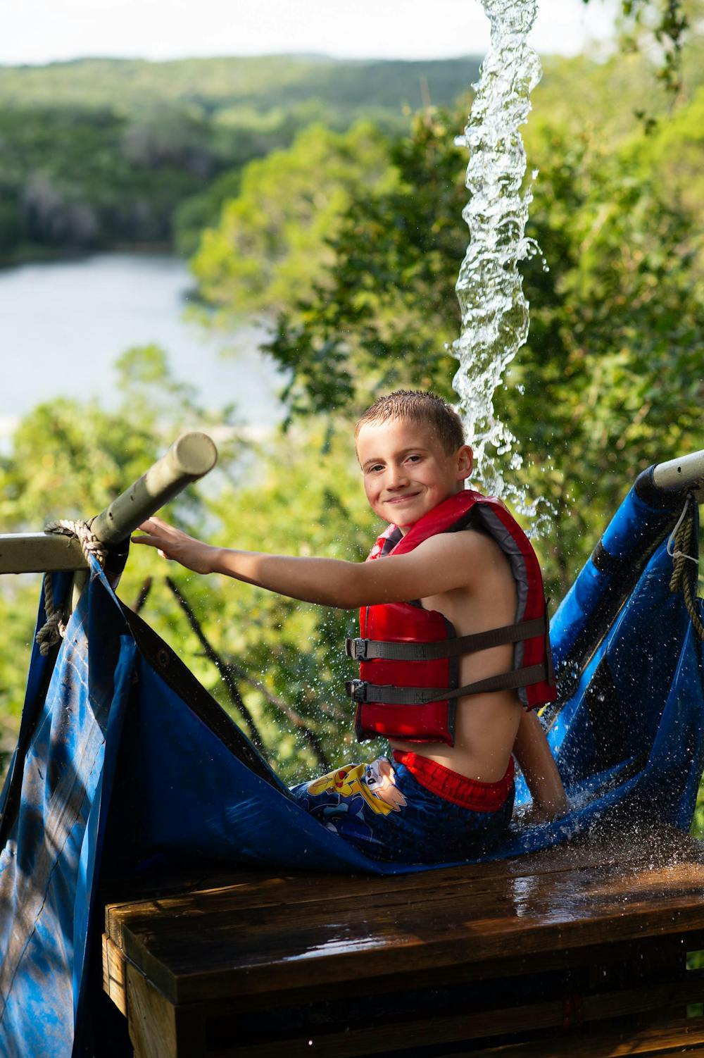 Boy on the water slide into lake ted.jpg?ixlib=rails 2.1
