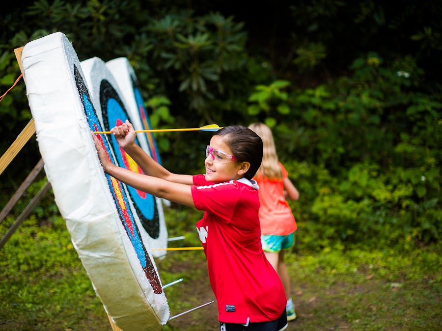 Pulling arrows out of targets at keystone camp for girls.jpg?ixlib=rails 2.1