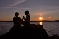 Two girls at new england summer camp watching sunset.jpeg?ixlib=rails 2.1
