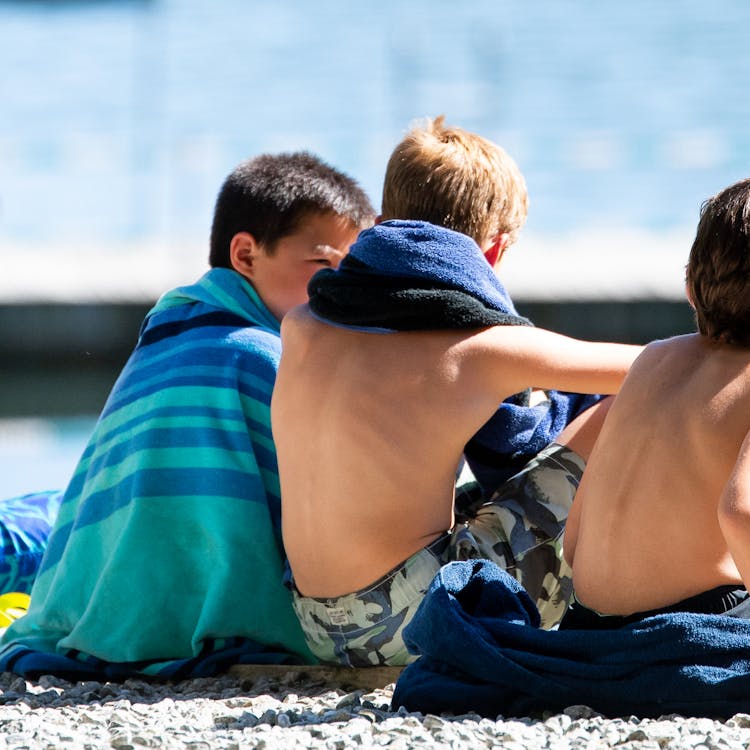 Boys by the lake at one of the best summer camps for kids.jpg?ixlib=rails 2.1