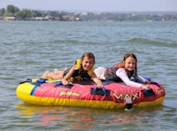 Two girls on floaty.jpeg?ixlib=rails 2.1