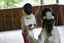Boy and girl fencing at camp.jpg?ixlib=rails 2.1