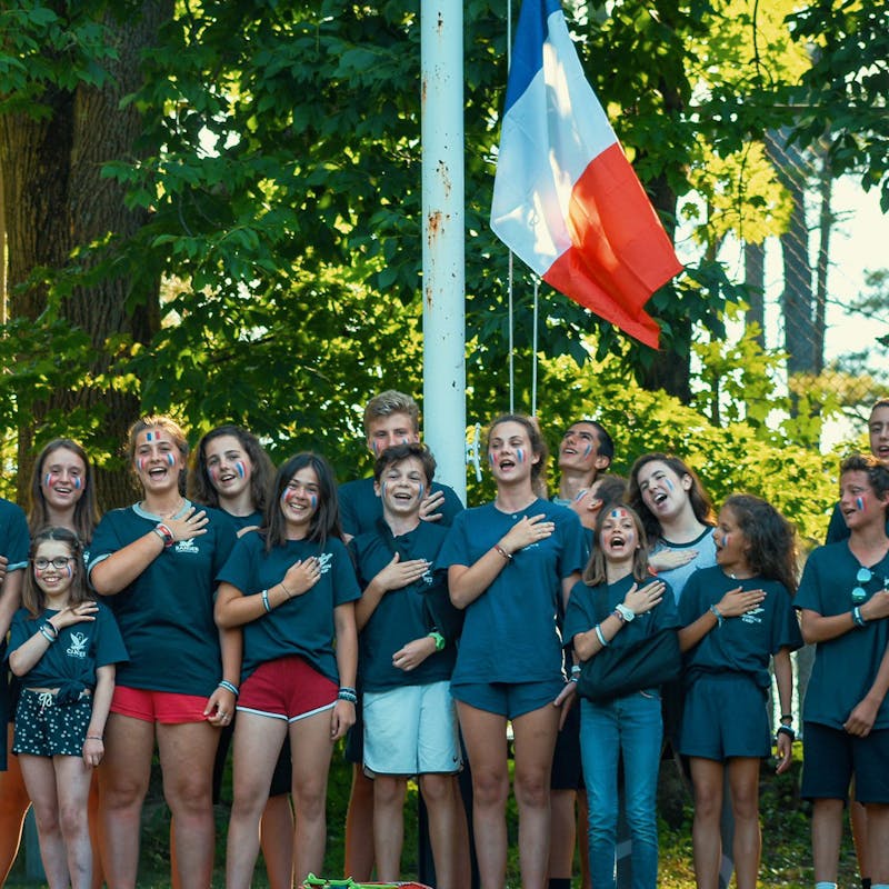 French campers singing.jpg?ixlib=rails 2.1