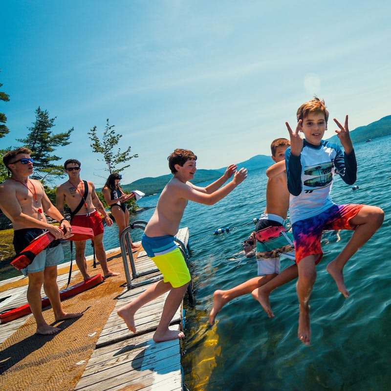 Three boys jumping into lake george.jpg?ixlib=rails 2.1