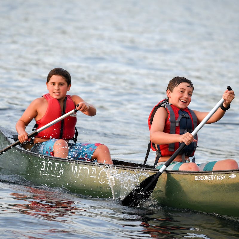 Two boys paddle a canoe.jpg?ixlib=rails 2.1