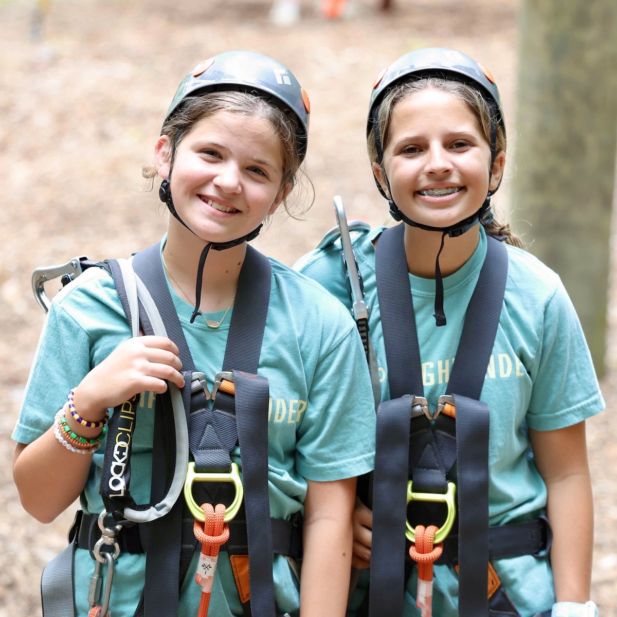 Girls laughing together at Camp Highlander
