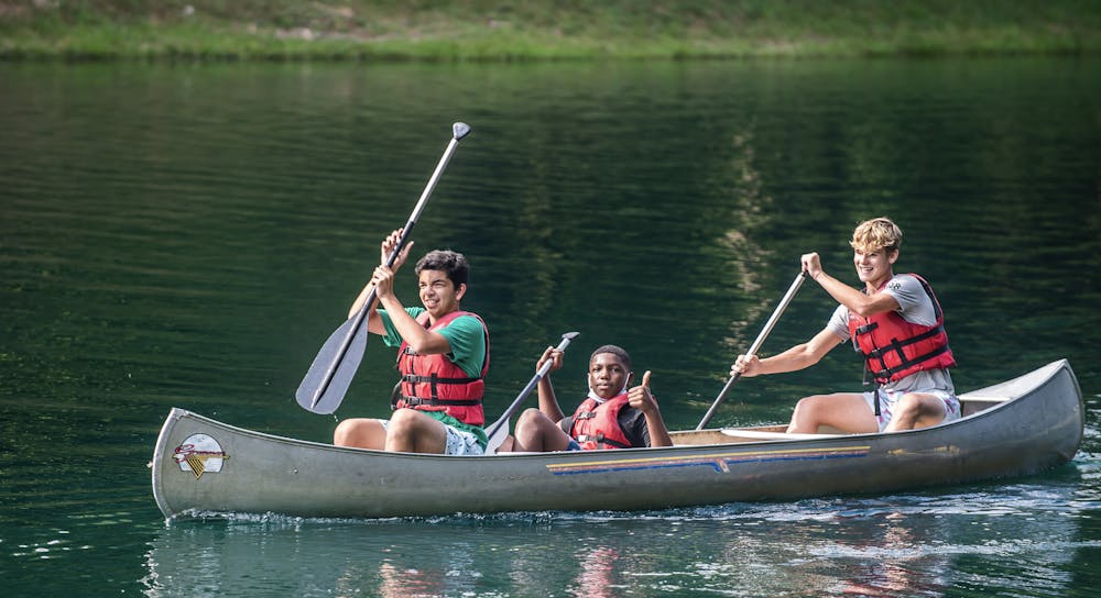 Boys in canoe.jpg?ixlib=rails 2.1
