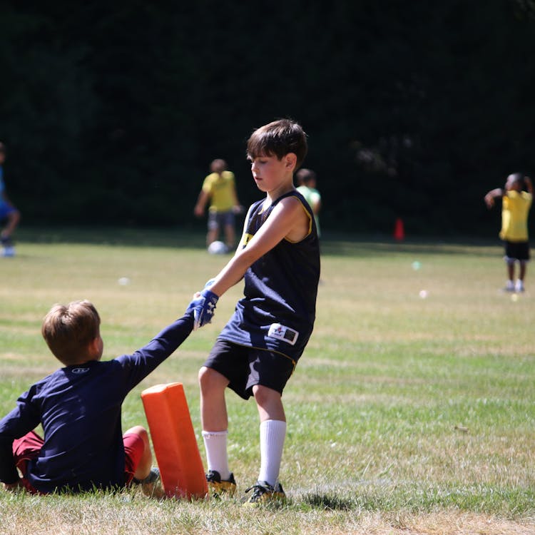 Boys sports camp soccer helping hand values.jpg?ixlib=rails 2.1