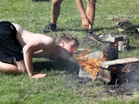 Building a fire at summer camp.jpg?ixlib=rails 2.1