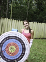 Girl shooting arrows at bullseye.jpg?ixlib=rails 2.1