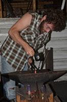 Tommy forging at blacksmithing summer camp north carolina.jpg?ixlib=rails 2.1