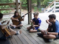 Teaching music at boys camp.jpeg?ixlib=rails 2.1