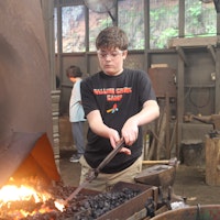 Blacksmithing at boys summer camp.jpg?ixlib=rails 2.1