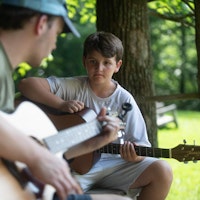 Boy with guitar music camp.jpg?ixlib=rails 2.1