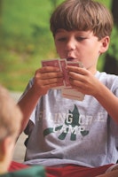 Boy playing cards at summer camp.jpg?ixlib=rails 2.1