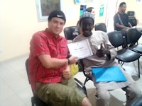 Ryan with modou jouf  he attended a workshop for counterparts for environment and agriculture sectors at the peace corps training center in thies and i am handing him his certificate of completion for the program he attended.jpg?ixlib=rails 2.1