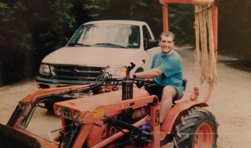 1990 simon wilson and tractor.jpg?ixlib=rails 2.1