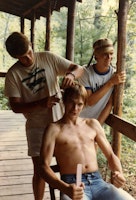 1983 cheap haircuts for mountaineering staff on penthouse porch  photo from joel priest  seated getting haircut   gordon strayhorn back left  dusty davis back right.jpg?ixlib=rails 2.1