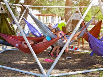 Boys and girls sleepaway camp in texas kids hanging out.jpg?ixlib=rails 2.1
