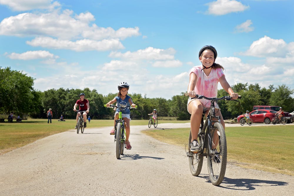 Jewish child riding bike at summer camp.jpg?ixlib=rails 2.1